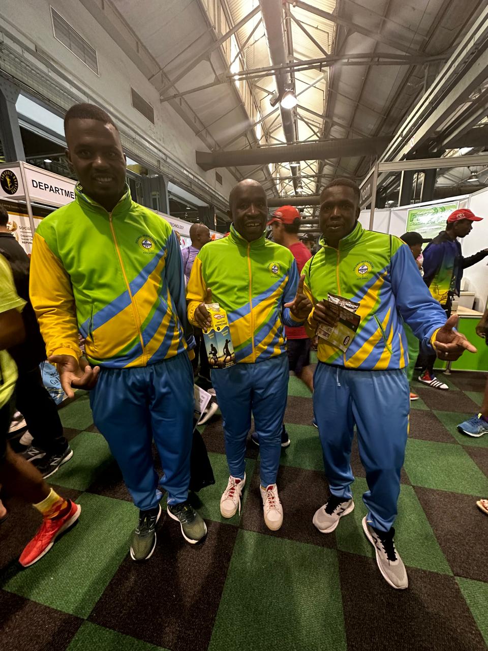 Three Folang runners collecting Comrades Marathon race packs